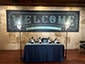 Event setup in a VIP lounge featuring Ai SketchBots and photo kiosks