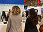 Guests posing at selfie kiosks, getting ready for their portraits to be drawn by SketchBots
