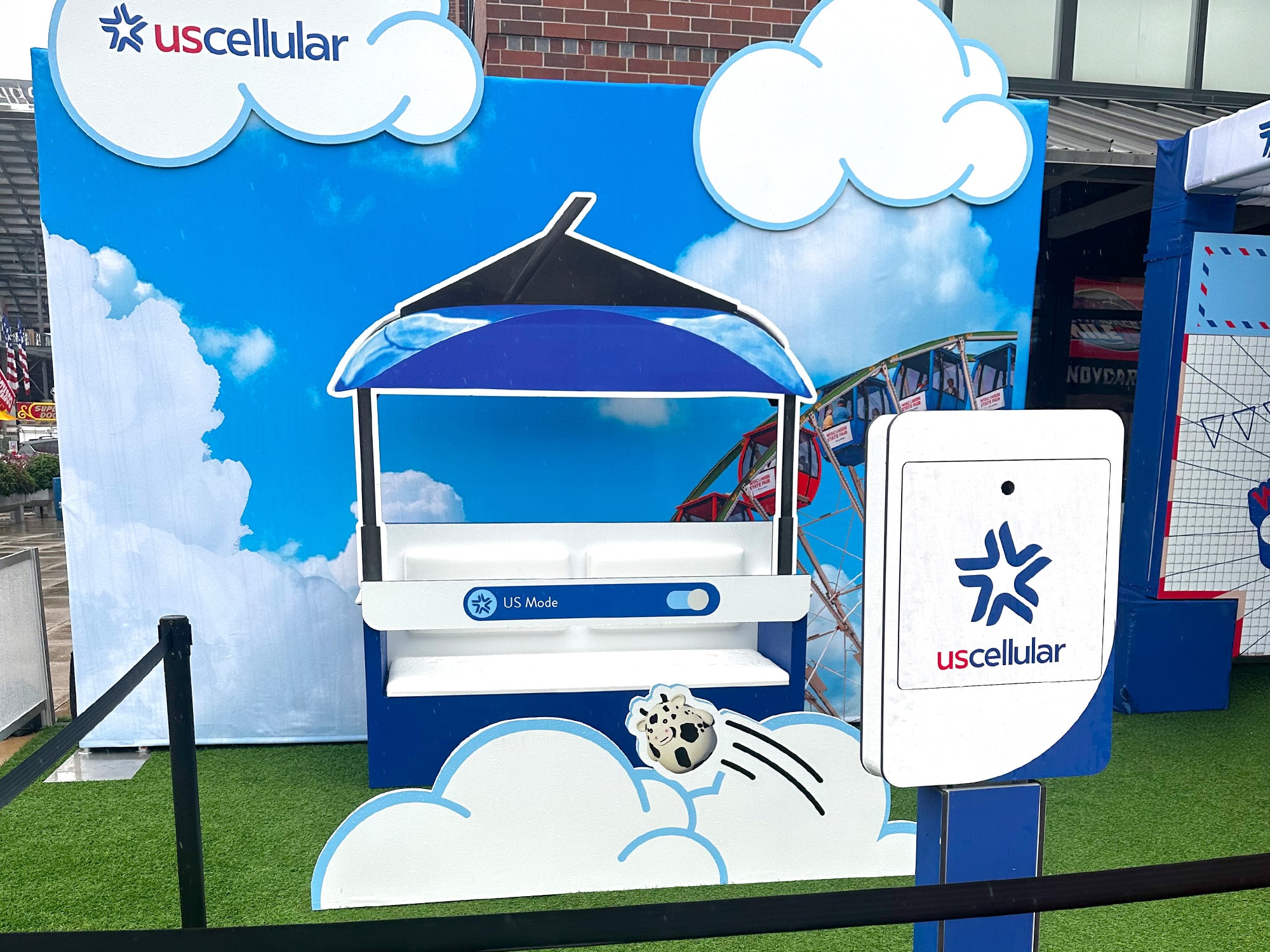 The set up of US Cellulars booth with the custom photo booth stand