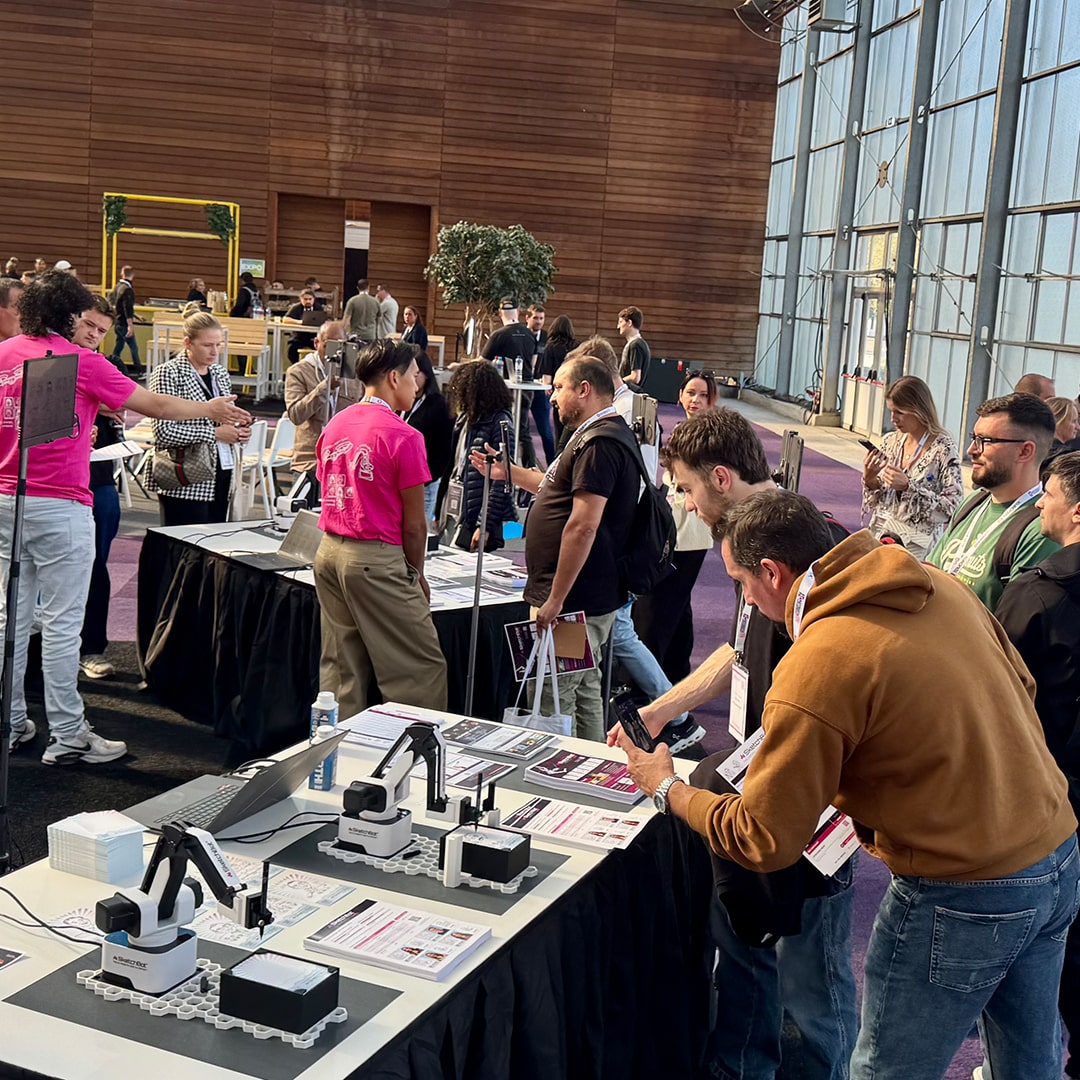 A crowd around the SketchBot Booth