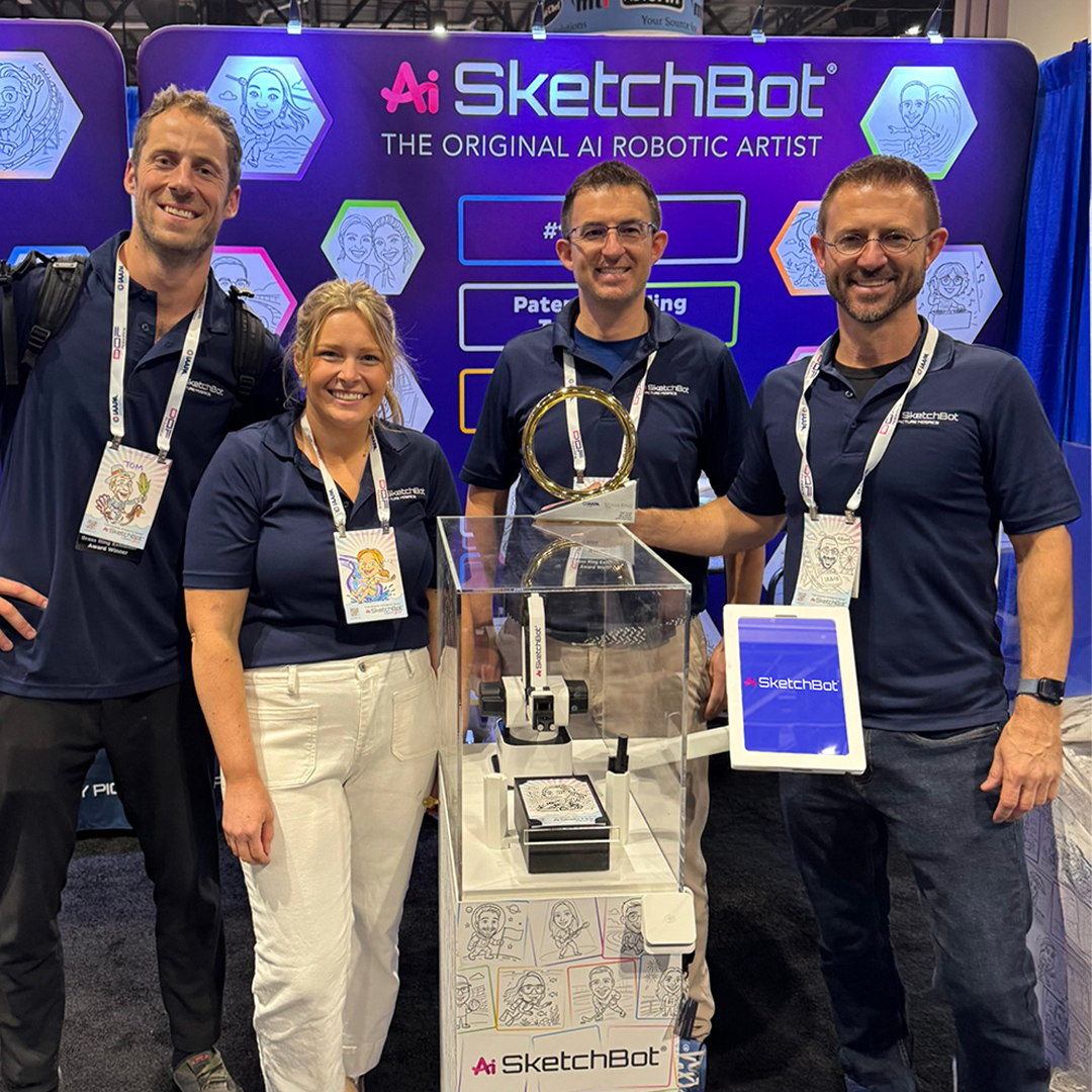The SketchBot crew at IAAPA with the Brass Ring Award