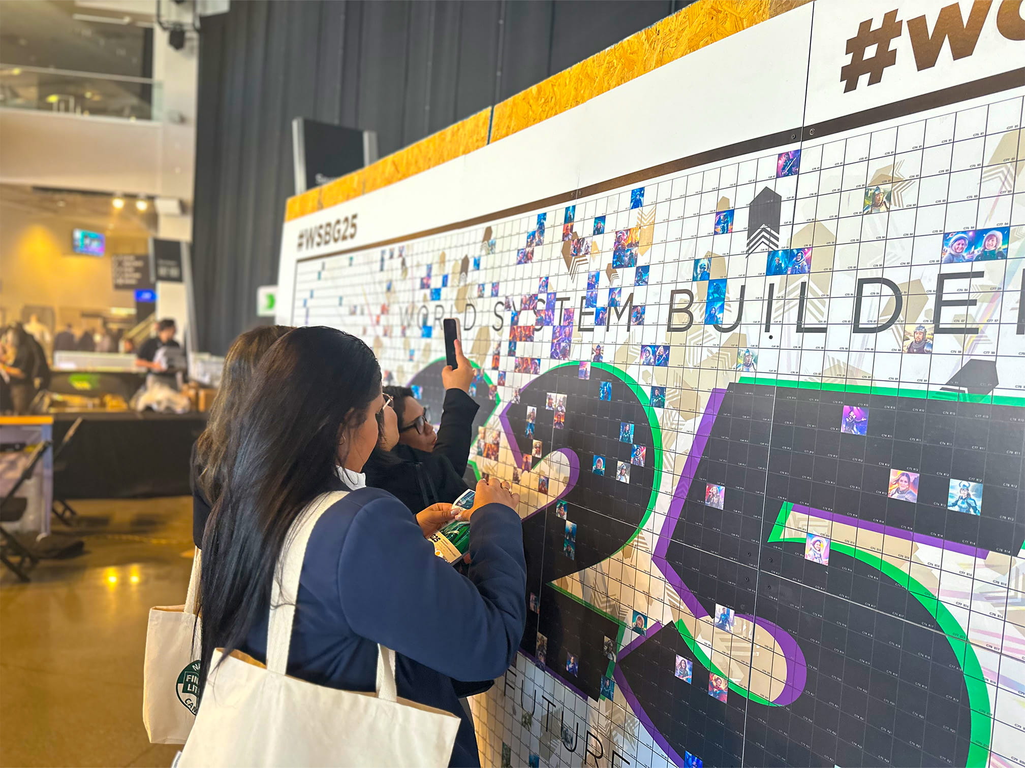 People putting their Ai persona prints on the big mosaic wall