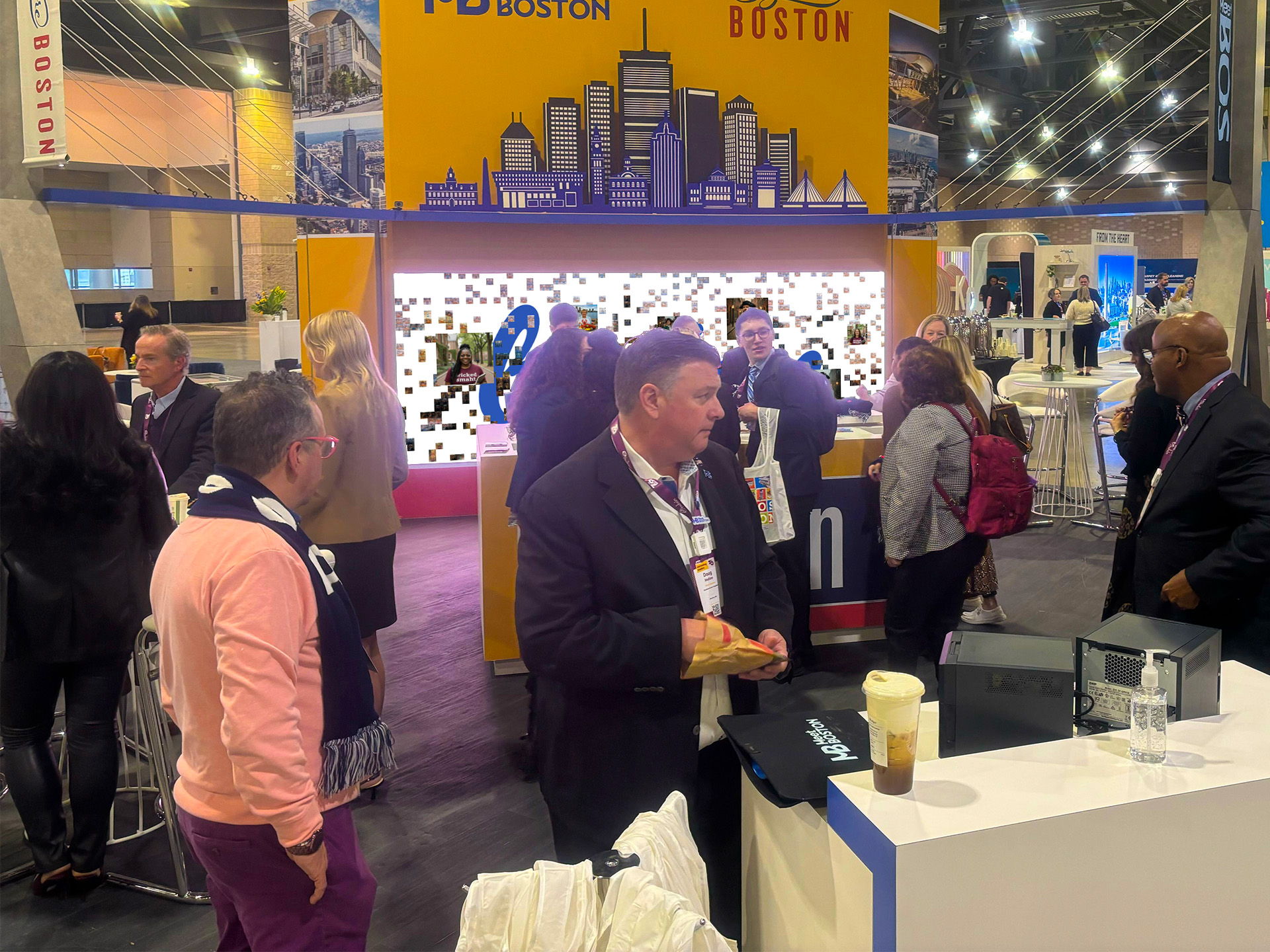 People around the booth at PCMA