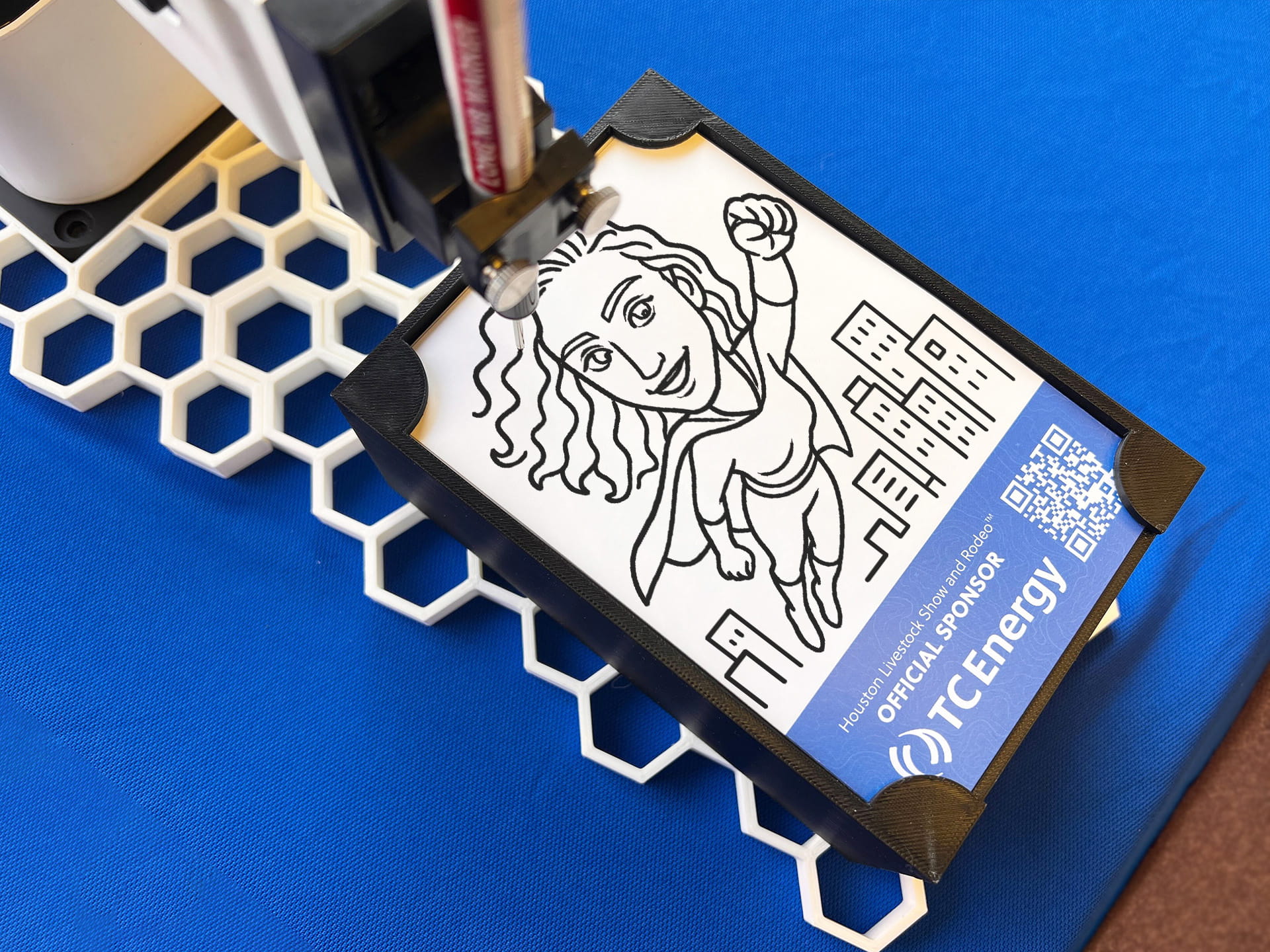 A close up of a sketch of a woman's portrait being completed on the SketchBot