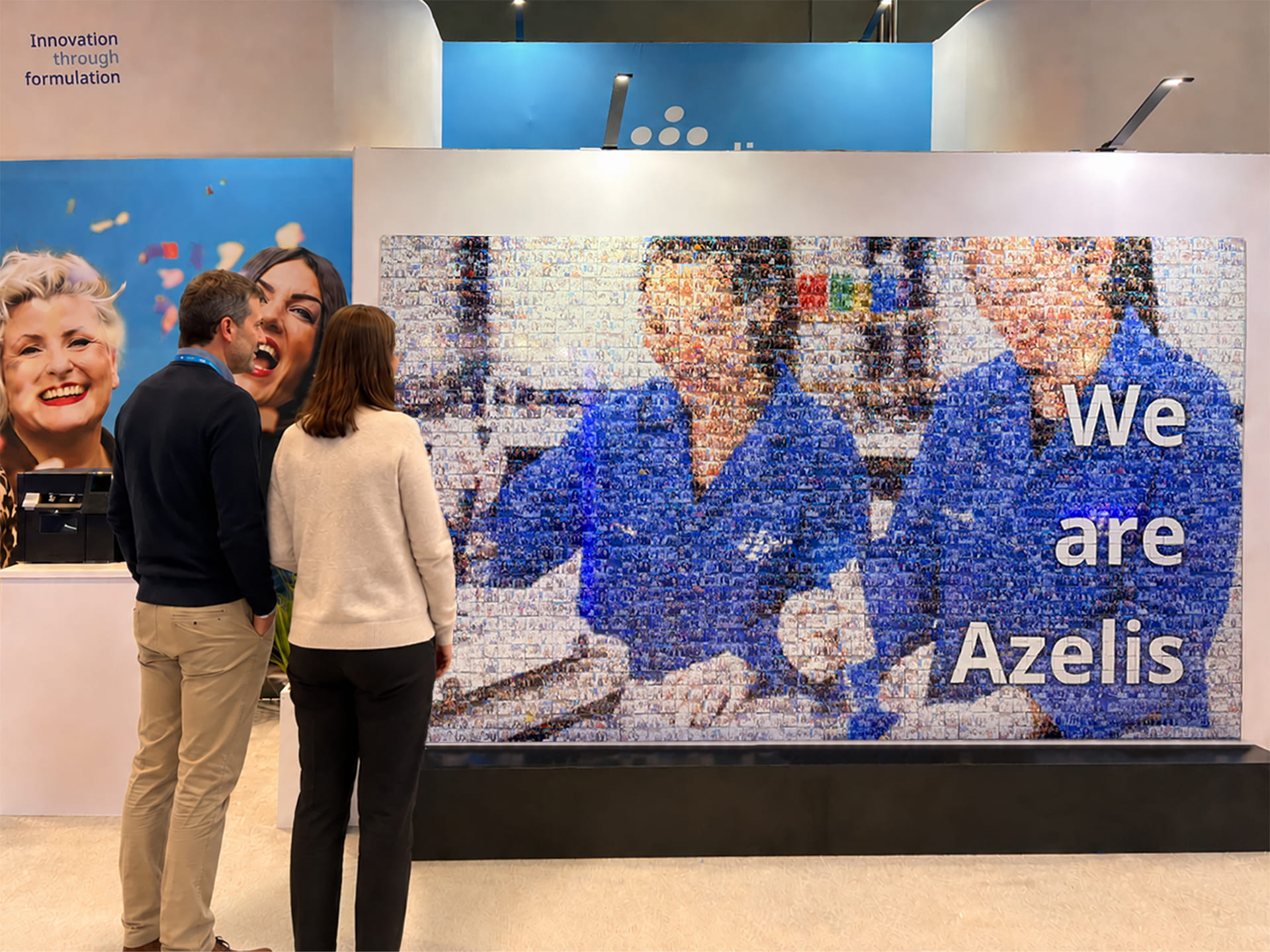 A man looking at his photo in the completed photo mosaic