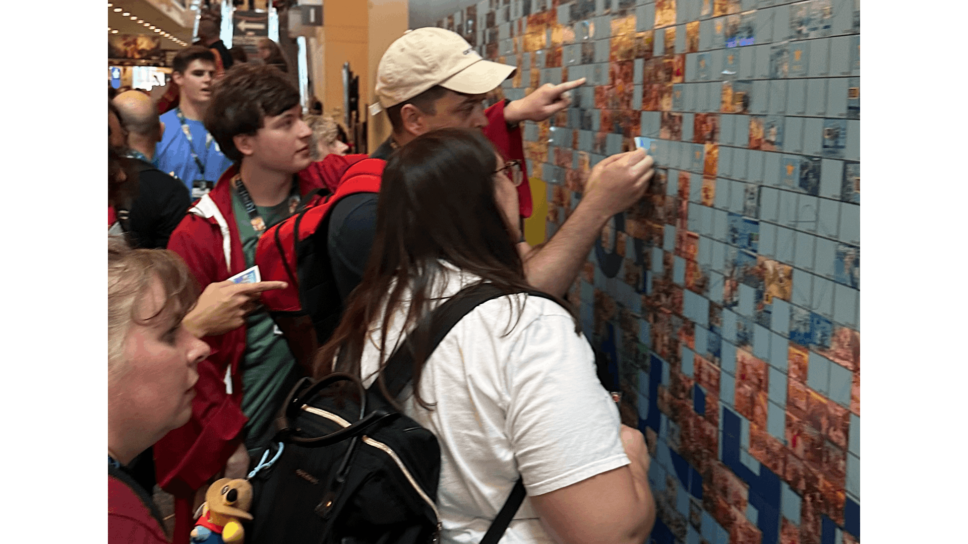 A crowd waiting to place their images onto the photo mosaic wall