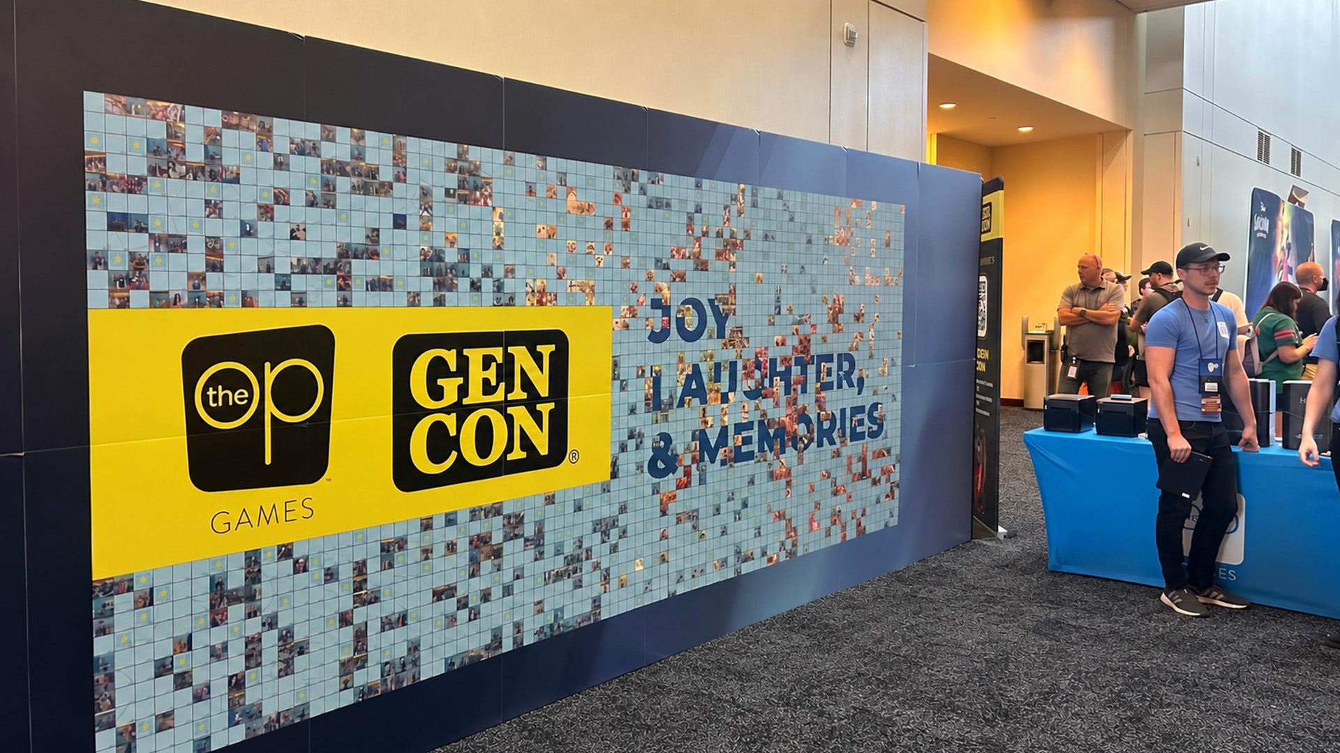 The set up of the photo mosaic wall at USAOPOLY's booth