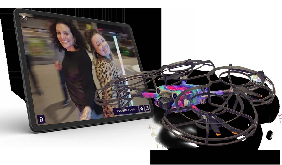 Guests posing inside the 360 Drone Experience capture zone at an event.