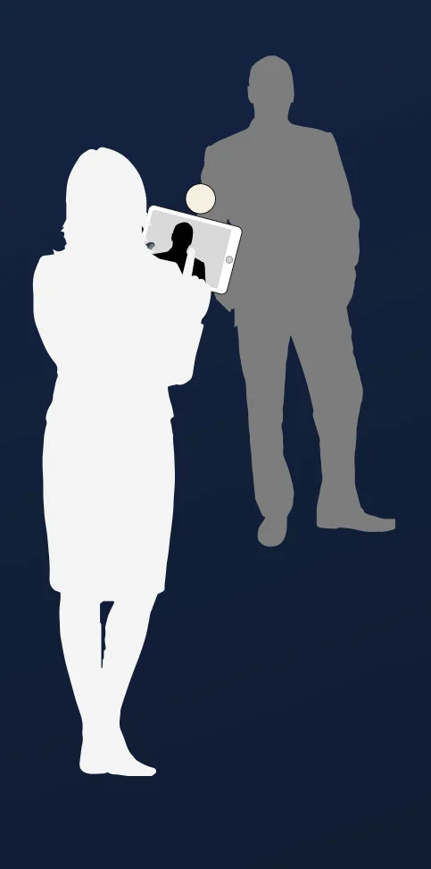 A brand ambassador photographing a guest with a tablet.
