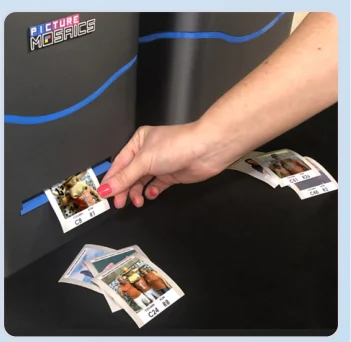 Hands holding printed mosaic cells.