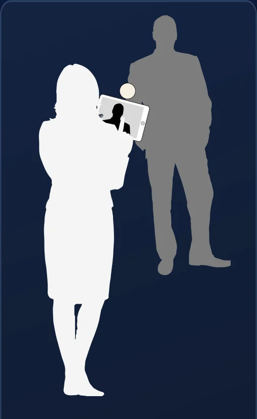 A brand ambassador photographing a guest with a tablet.