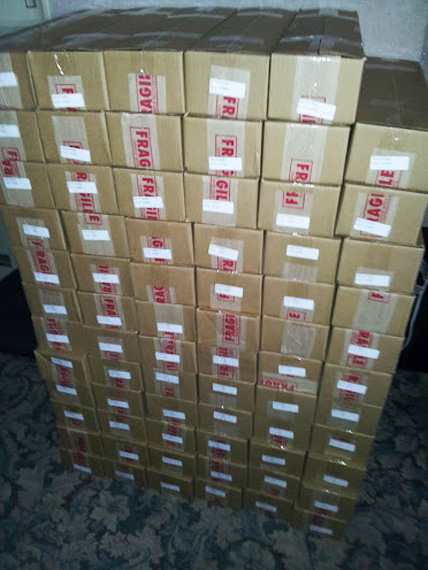 71 boxes containing 176,750 printed photos are stacked and ready to go!