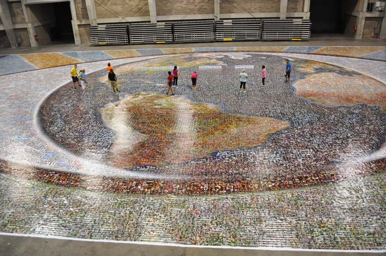 Volunteers browse the finished mosaic.