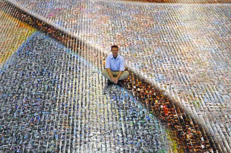 Picture Mosaics CEO, Al Charpentier, sits in the sea of photos - a very unique experience.
